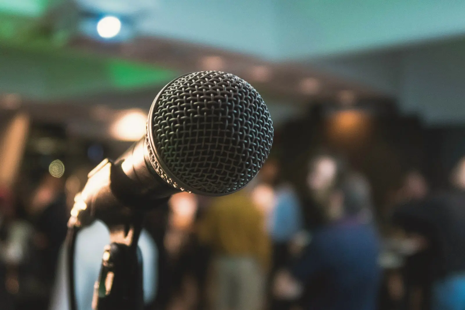 Microphone on stage in front of an audience